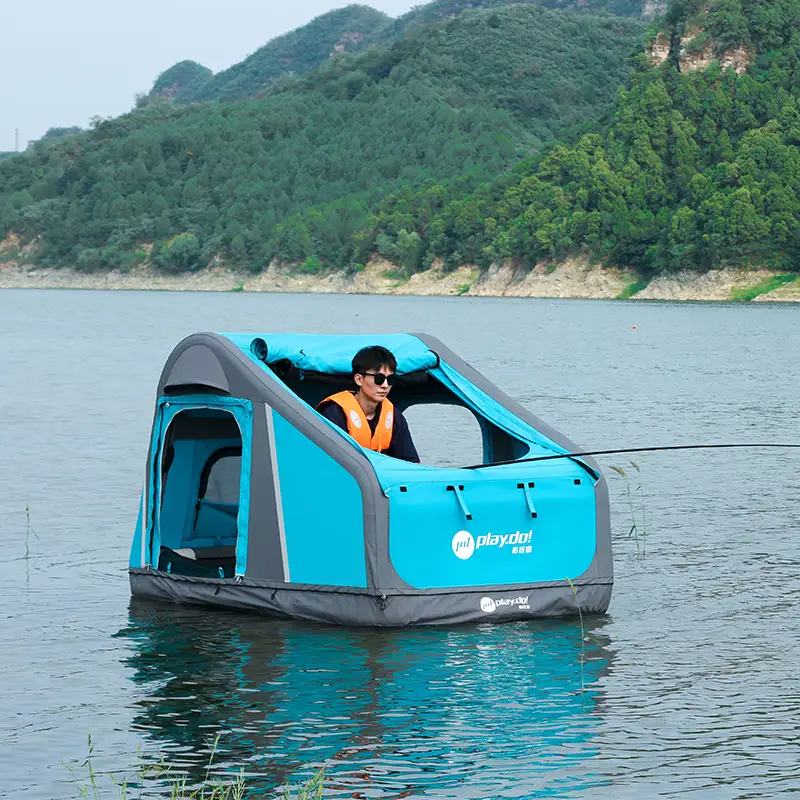 Fish Island inflatable tent floating on calm water as fishing platform, turquoise 3-in-1 water mode with life jacket