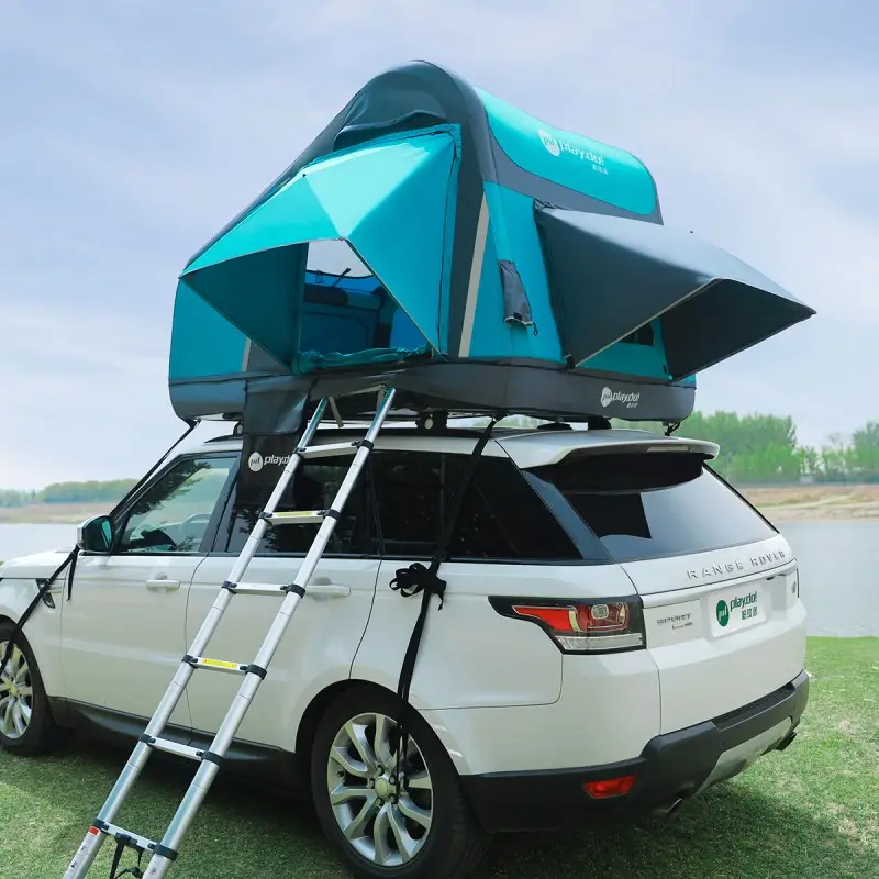 Fish Island inflatable rooftop tent rear view on white SUV with ladder, lake-view family camping setup