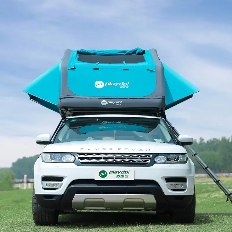 Fish Island rooftop tent front view on white SUV, turquoise poly-cotton shell with PlayDo logo, easy roof mounting