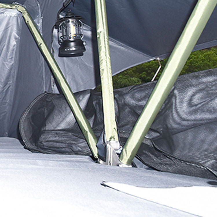 Interior of soft shell rooftop tent showing green aluminum poles, stainless steel hinge, 6cm mattress, and camping lantern hanging.