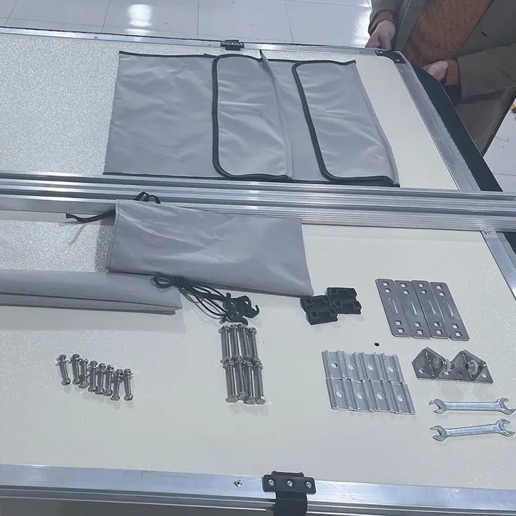 Soft shell rooftop tent installation kit and accessories, including mounting brackets, screws, wrenches, storage bags, and hardware.
